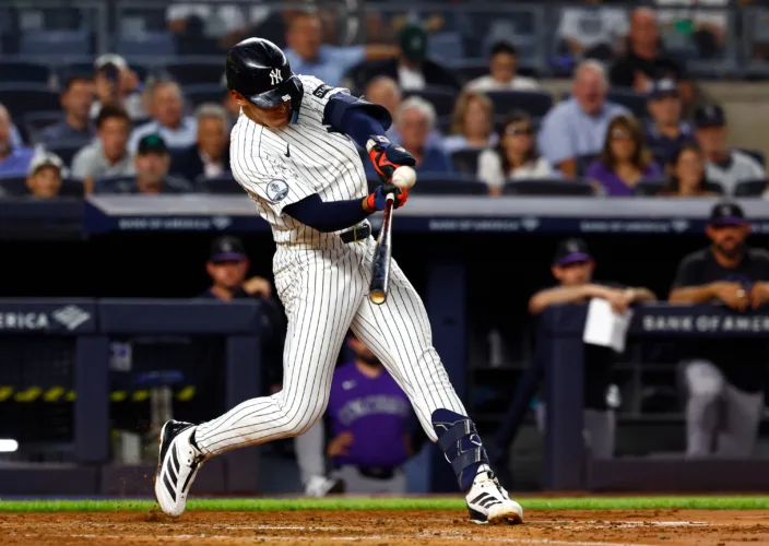 Lombard hits 1st grand slam, Yanks roll Rockies 6-1